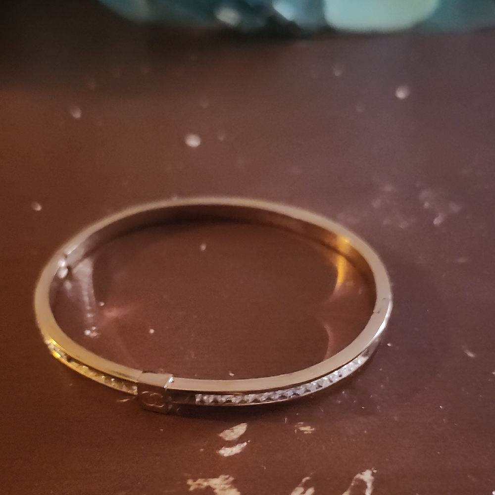 Elegant Gold Bracelet with Silver Accents